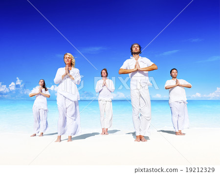 People performing yoga on the beach Peaceful Concept 19212329
