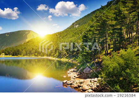 picturesque lake, mountains and blue sky 19216384