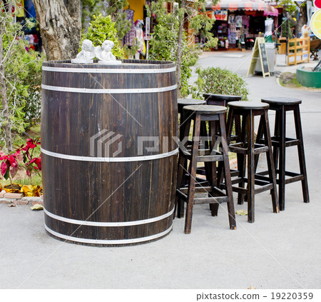 Old wooden barrel with wood stool bar 19220359