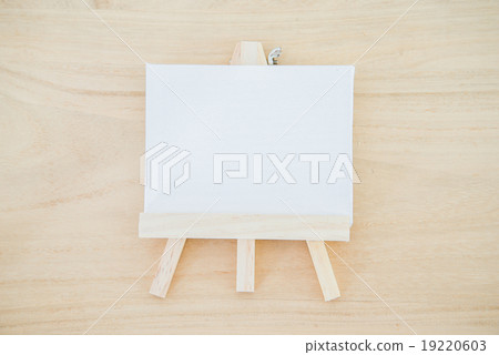 White canvas art board on wood texture background White canvas art board on wood texture background 19220603