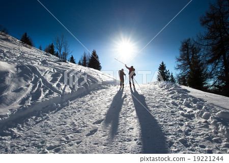 Alpine skiers uphill 19221244