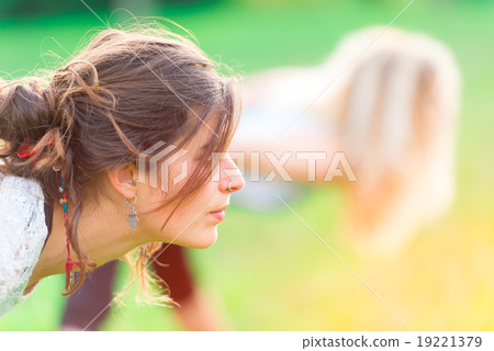 Girls do gymnastics at the park 19221379