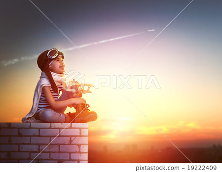 girl playing with toy airplane 19222409