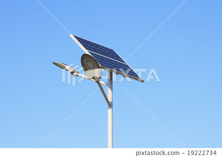 Solar panels with led lamp over blue sky 19222734