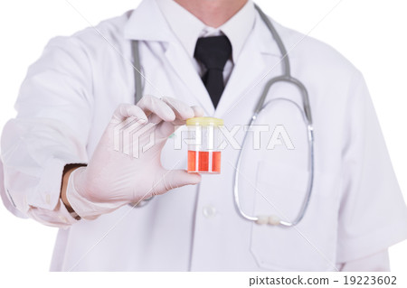 doctor's hand holding a bottle of bloody urine  19223602