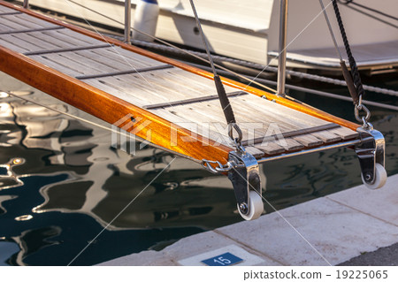 wooden ladder on marine yacht staying in port 19225065