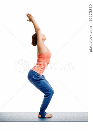 Woman doing ashtanga vinyasa yoga asana Utkatasana Woman doing ashtanga vinyasa yoga asana Utkatasana 19225850