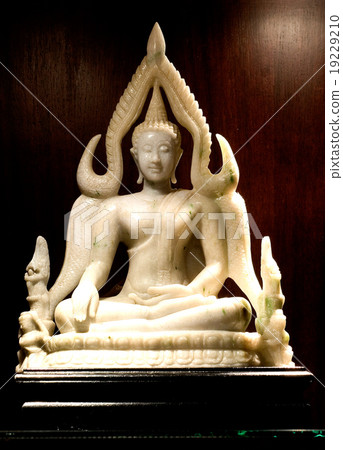 Jade sculpture of buddha isolated on wooden 19229210