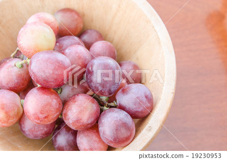grapes on a wooden table grapes on a wooden table 19230953