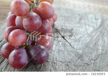 grapes on a wooden table grapes on a wooden table 19230955