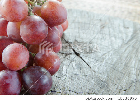 grapes on a wooden table grapes on a wooden table 19230959