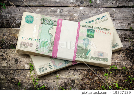 Pile of money in wrapper 19237129