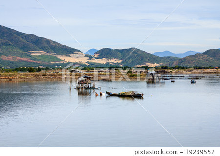 Fisherman at Tac river, Nha Trang, Vietnam 19239552