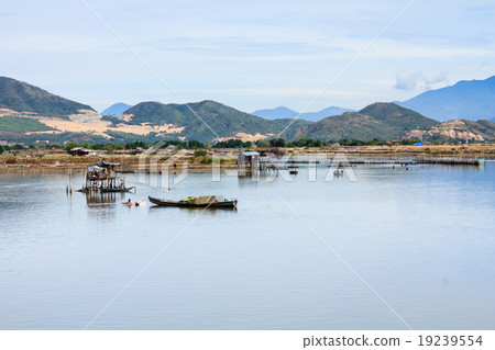 Fisherman at Tac river, Nha Trang, Vietnam Fisherman at Tac river, Nha Trang, Vietnam 19239554