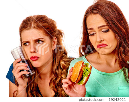 Unhappy couple girl eating fast food. Unhappy couple girl eating fast food. 19242021
