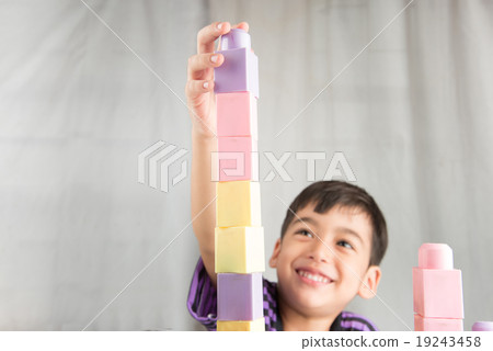 Little boy playing blocks at home Little boy playing blocks at home 19243458