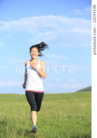 Runner athlete running on grass seaside Runner athlete running on grass seaside 19244296