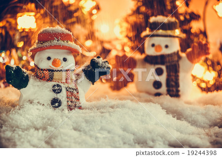 Snowman and snow is falling down with a light bulb Snowman and snow is falling down with a light bulb 19244398