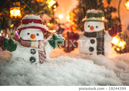 Snowman and snow is falling down with a light bulb Snowman and snow is falling down with a light bulb 19244399
