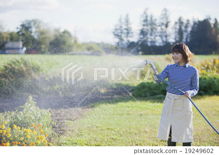 A girl wearing gardening 19249602