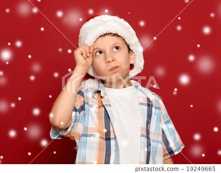 winter holiday christmas - boy in santa hat winter holiday christmas - boy in santa hat 19249665