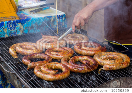 Homemade northern Thai sausage on grill. Homemade northern Thai sausage on grill. 19250869