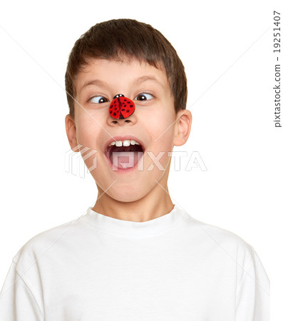 boy with ladybug on face, teenager fun portrait closeup boy with ladybug on face, teenager fun portrait closeup 19251407