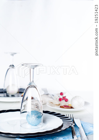 Stylish blue and silver Christmas table setting 19251423