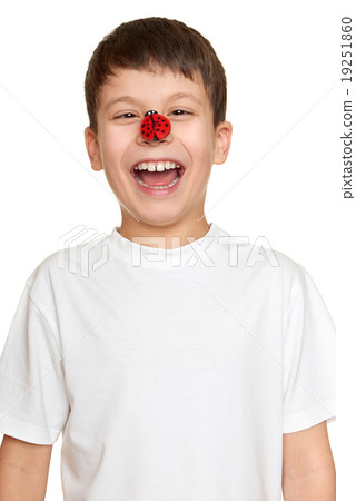 boy with ladybug on face, teenager fun portrait closeup 19251860