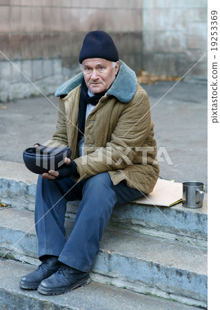 Homeless man holding his cap. Homeless man holding his cap. 19253369
