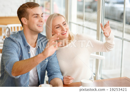 Loving couple sitting in the cafe  19253421