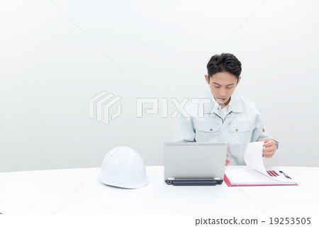 Workers holding heads by looking up records 19253505