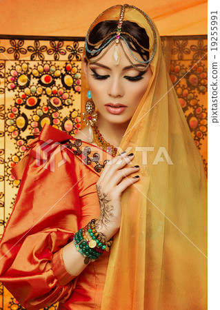 Beautiful girl in orange dress Beautiful girl in orange dress 19255991
