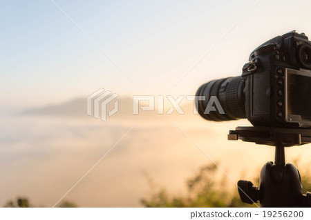 DSLR camera focus on sunrise lanscape sceen DSLR camera focus on sunrise lanscape sceen 19256200