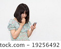 A woman with a smartphone A woman with a smartphone 19256492