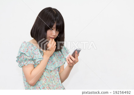 A woman with a smartphone 19256492