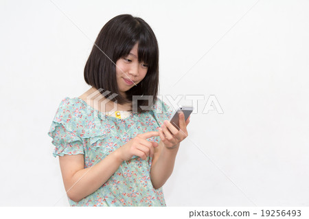 A woman with a smartphone A woman with a smartphone 19256493