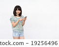A woman with a smartphone A woman with a smartphone 19256496