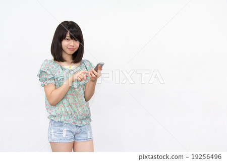A woman with a smartphone A woman with a smartphone 19256496