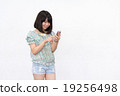 A woman with a smartphone A woman with a smartphone 19256498