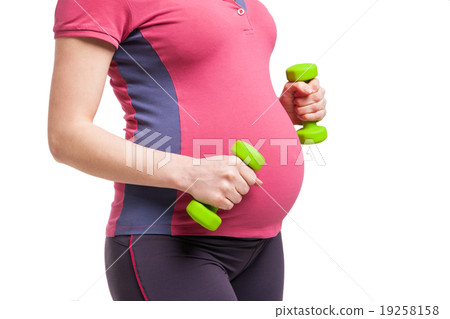 Happy pregnant mom exercising with dumbbells Happy pregnant mom exercising with dumbbells 19258158