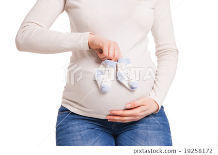 hands of happy pregnent woman holding child socks hands of happy pregnent woman holding child socks 19258172