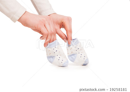 hands of happy pregnent woman holding child socks hands of happy pregnent woman holding child socks 19258181