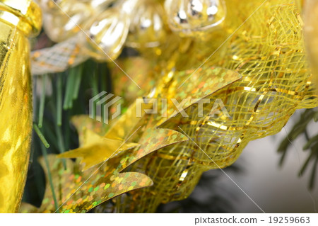 Image of Christmas tree branch and golden material Image of Christmas tree branch and golden material 19259663