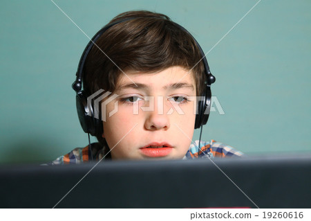 boy with headphones listen to popular music boy with headphones listen to popular music 19260616