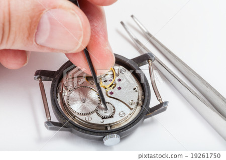 horologer repairs old watch close up 19261750