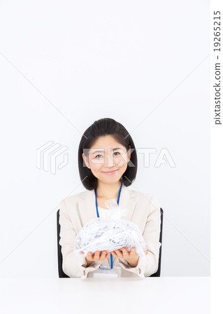 Business woman discarding shredder garbage 19265215
