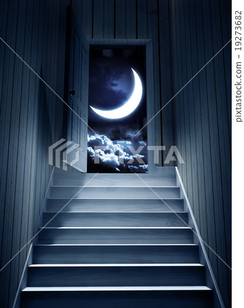 Steps leading from a dark basement to open door 19273682