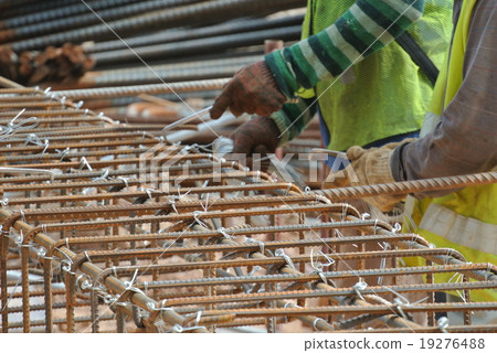 Workers fabricating column steel reinforcement bar Workers fabricating column steel reinforcement bar 19276488