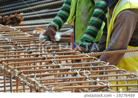 Workers fabricating column steel reinforcement bar Workers fabricating column steel reinforcement bar 19276489